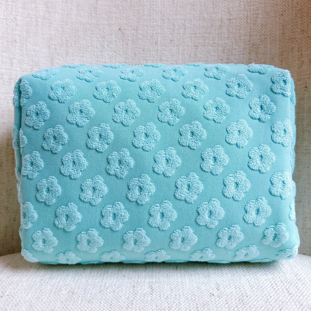 Trousse de toilette à motif de marguerites en relief