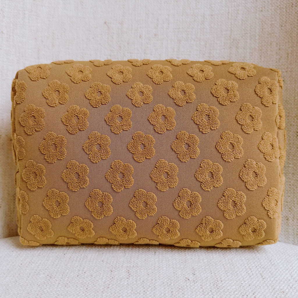 Trousse de toilette à motif de marguerites en relief